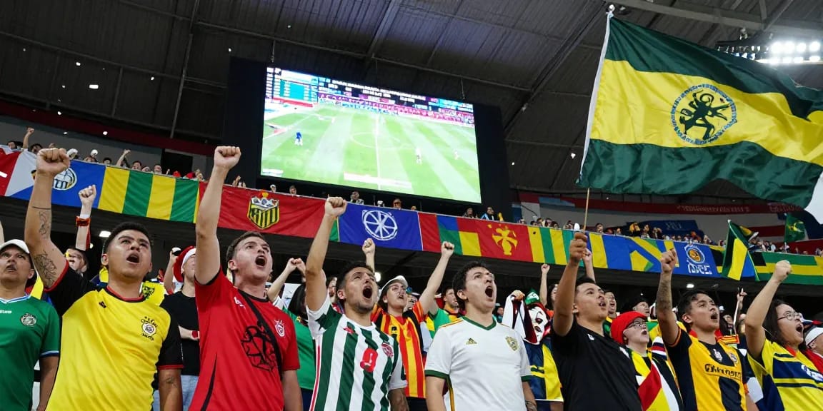 Fans celebrating at the 2026 World Cup stadium, showcasing team spirit and excitement, with more資訊 about the event.
